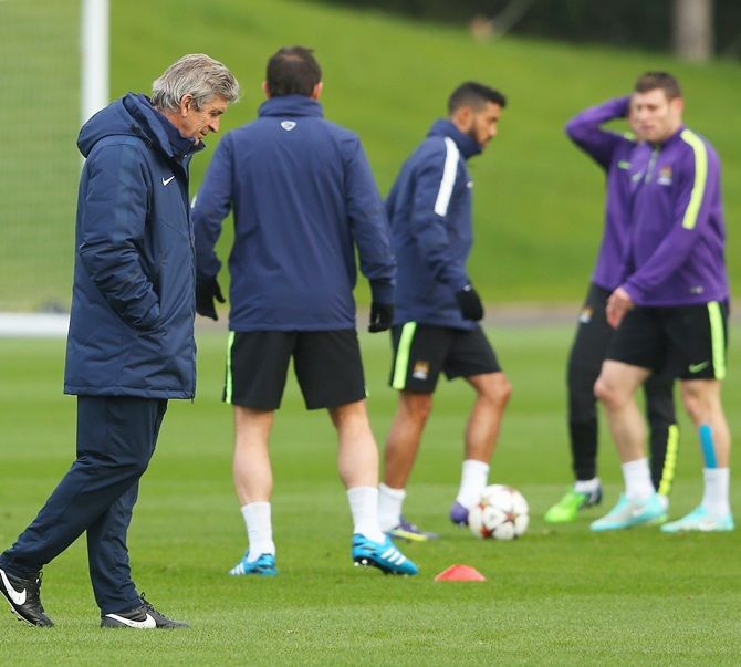 Manuel Pellegrini the manager of Manchester City looks on during a training session