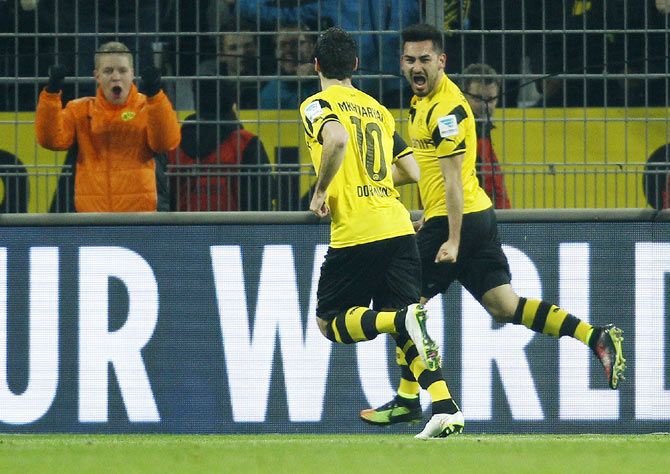 Borussia Dortmund's Ilkay Gundogan and Henrikh Mkhitaryan (left) celebrate a goal against Hoffenheim during their Bundesliga match in Dortmund on Sunday