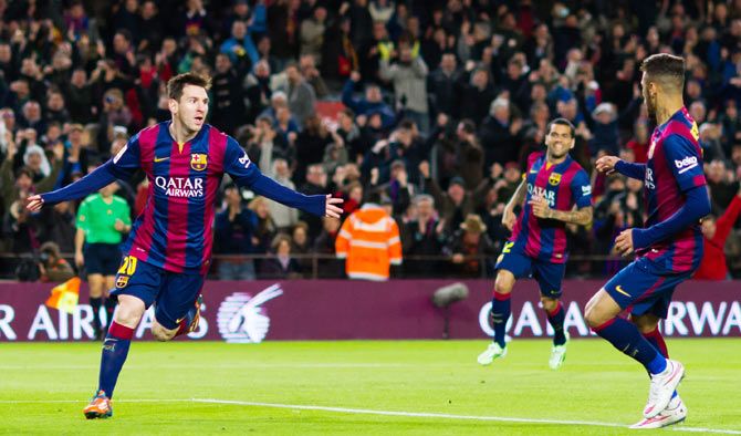 Lionel Messi celebrates after scoring against Espanyol on Sunday