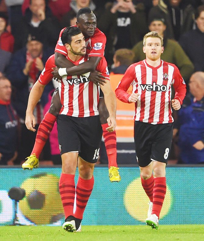 Graziano Pelle of Southampton celebrates with teammate Sadio Mane after scoring the equaliser on Monday.