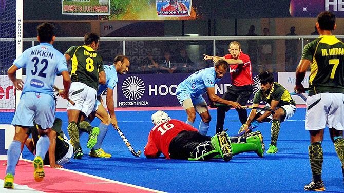 India and Pakistan players are involved in a goal-mouth melee in second semi-final of Champions Trophy at Kalinga Stadium in Bhubaneswar on Saturday
