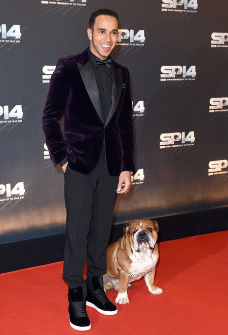 Lewis Hamilton and his dog Roscoe attend the BBC Sports Personality of the Year awards at The Hydro in Glasgow, Scotland, on Sunday