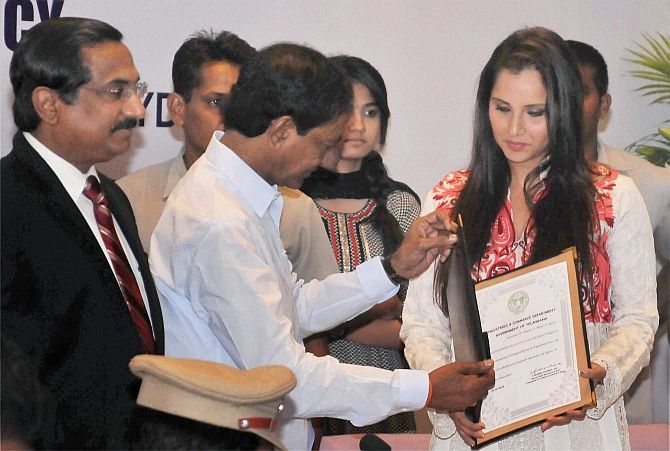Telangana CM K Chandrashekhar Rao presents a letter of appointment as the brand ambassador of the state to Sania Mirza