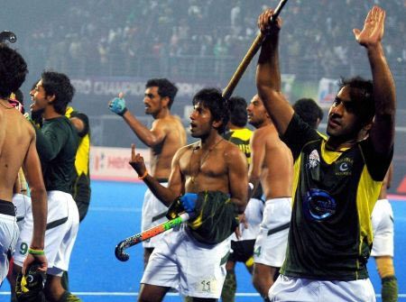 Pakistan hockey players react after winning the Champions Trophy semi-final game against India in Bhubaneswar