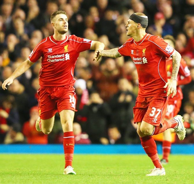 Martin Skrtel, right, of Liverpool celebrates scoring his goal with Jordan Henderson