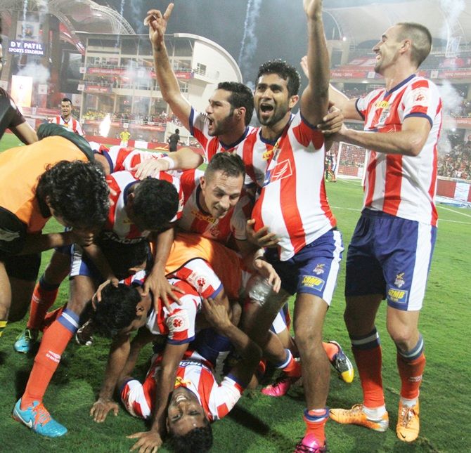 Mohammad Rafique, below, of Atletico de Kolkata celebrates with teammates