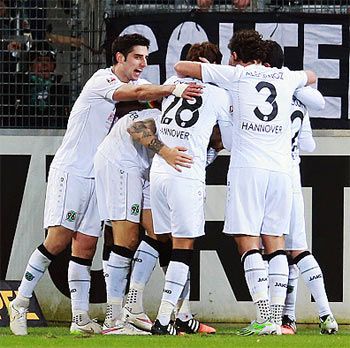 Players of Hannover celebrate their second goal against SC Freiburg during their Bundesliga match at Schwarzwald-Stadion in Freiburg im Breisgau, Germany, on Sunday