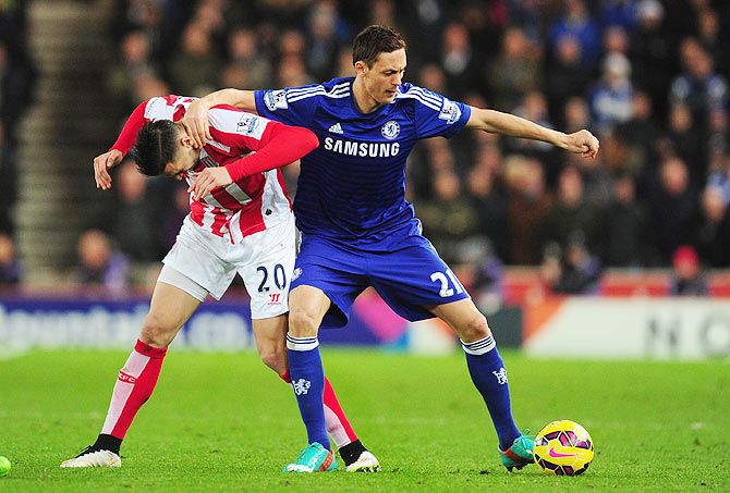 Chelsea's Nemanja Matic (right) and Stoke's Geoff Cameron get in a tangle as they vie for possession