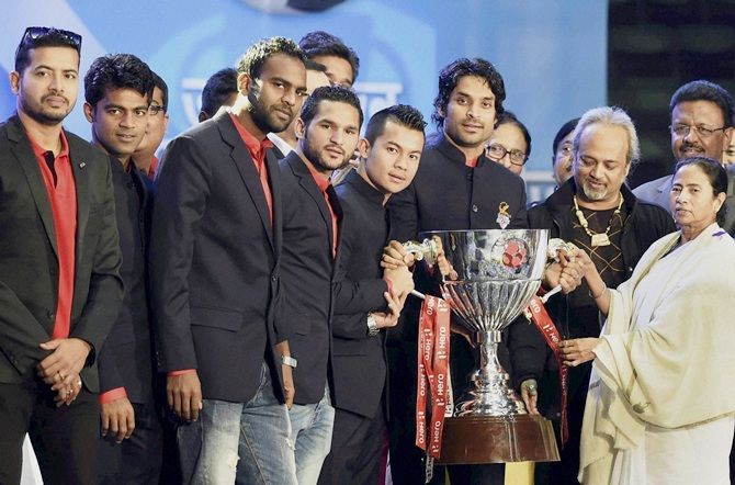 West Bengal Chief Minister Mamata Banerjee with the players of Atletico De Kolkata