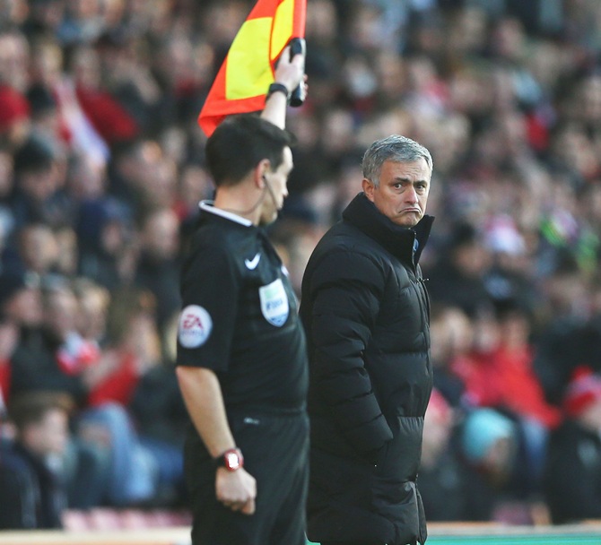 Jose Mourinho, manager of Chelsea reacts as the assistant referee gives a decision