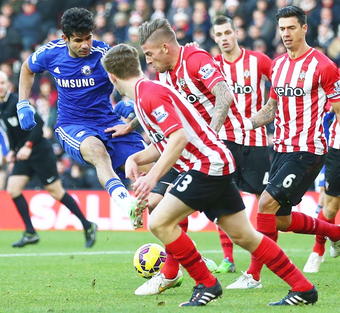 Diego Costa, left, of Chelsea has a shot blocked by Toby Alderweireld of Southampton