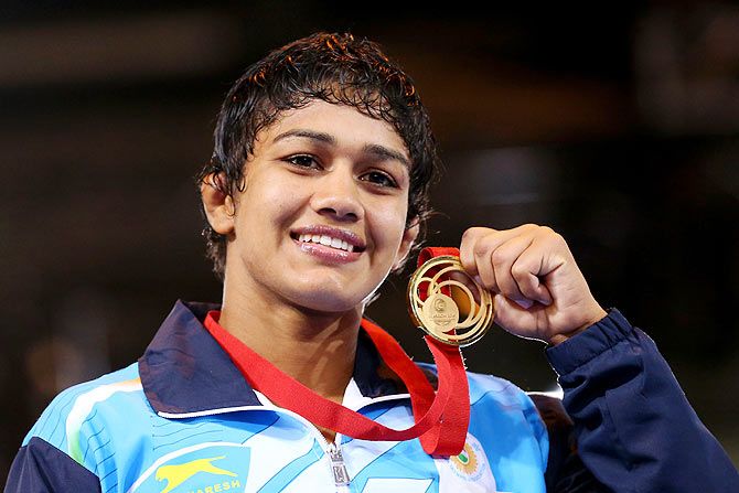 Gold medallist Babita Kumari of India poses during the medal ceremony for the Women's FS 55kg at Scottish Exhibition and Conference Centre at the Glasgow 2014 Commonwealth Games on July 31