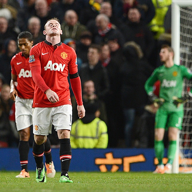 Wayne Rooney of Manchester United reacts after Fulham's second goal.