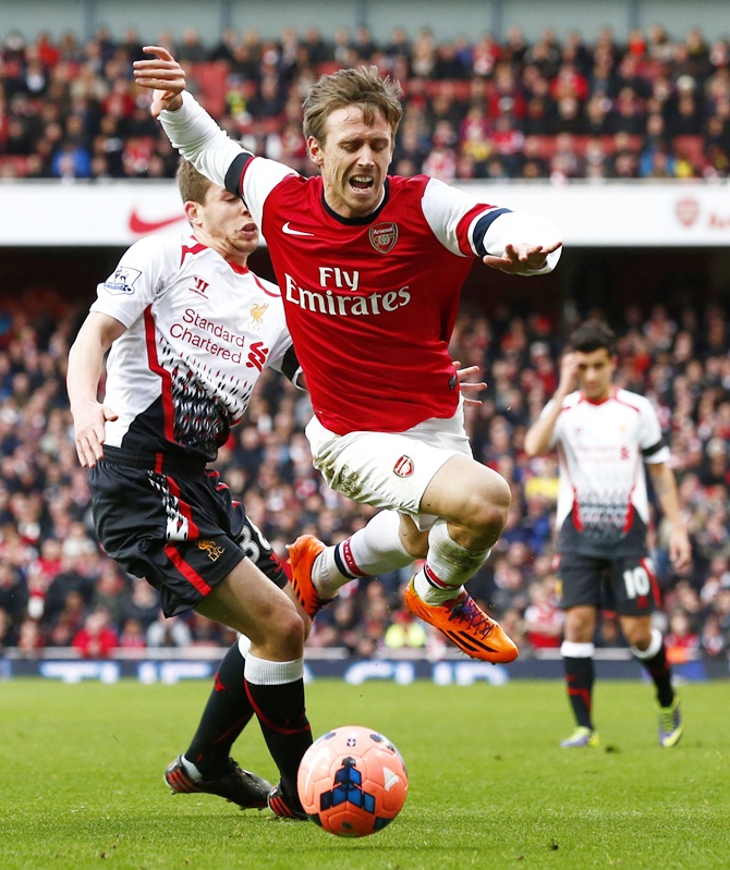 Arsenal's Nacho Monreal, right, is fouled by Liverpool's Jon Flanagan during their FA Cup  match.