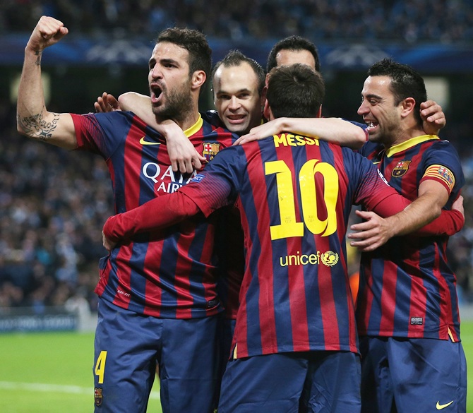 Lionel Messi of Barcelona celebrates scoring the opening goal from a penalty