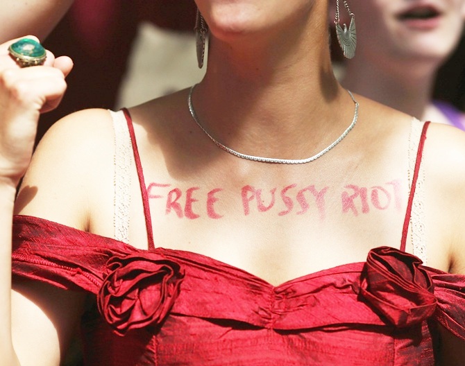 A woman wears on her chest the text 'free pussy riot' as a demonstration by supporters of the jailed feminist punk band 'Pussy Riot'.