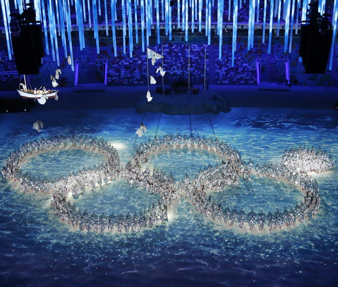 Performers form the Olympic rings during the closing ceremony.
