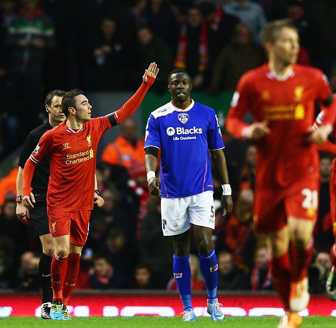 Iago Aspas of Liverpool celebrates scoring the opening goal