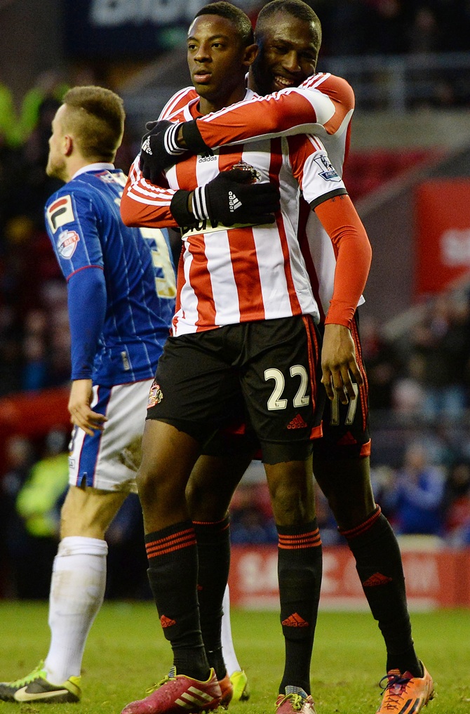 El Hadji Ba (second left) of Sunderland celebrates with as his team-mate Jozy Altidore