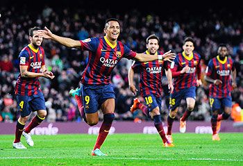 Alexis Sanchez of FC Barcelona celebrates after scoring his team's fourth goal against Elche FC during the La Liga match at Camp Nou on Sunday