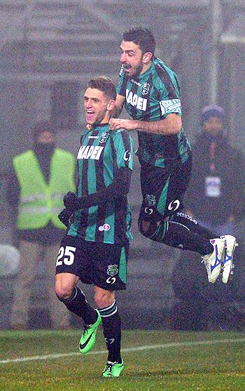 Domenico Berardi of US Sassuolo Calcio (left) celebrates scoring his fourth goal during their Serie A match against AC Milan in Sassuolo, on Sunday