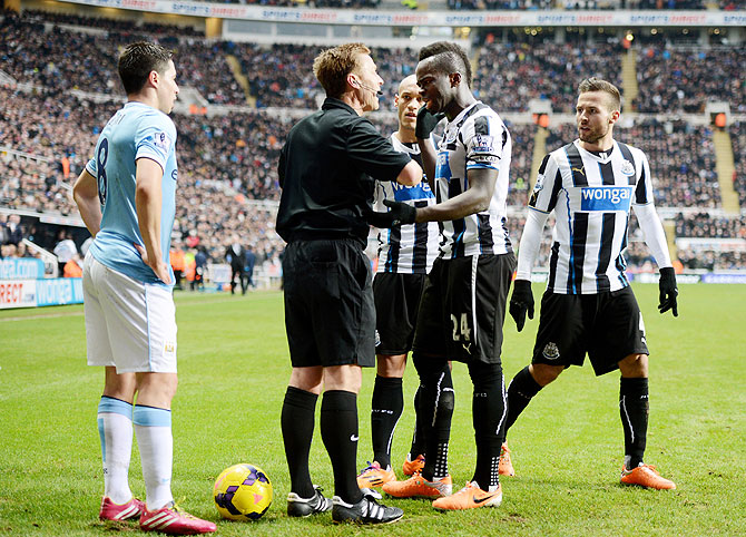 Cheik Ismael Tiote of Newcastle remonstrates with Referee Mike Jones after his goal is disallowed for being offside during the Barclays Premier League match at St James' Park in Newcastle upon Tyne on Sunday