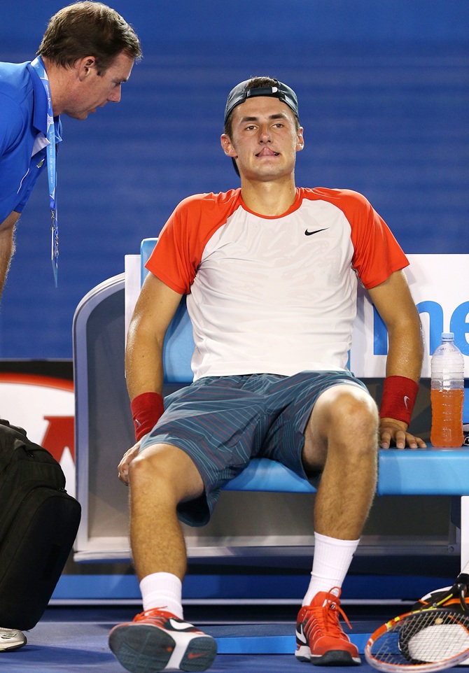 Bernard Tomic retires from his first round match against Rafael Nadal
