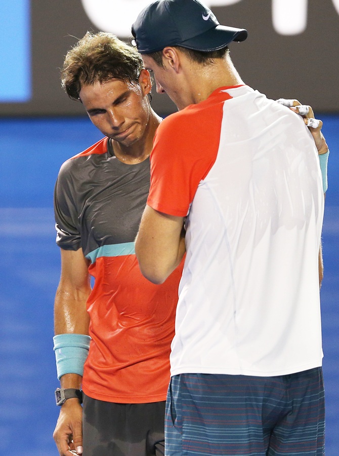 Bernard Tomic of Australia and Rafael Nadal of Spain talk
