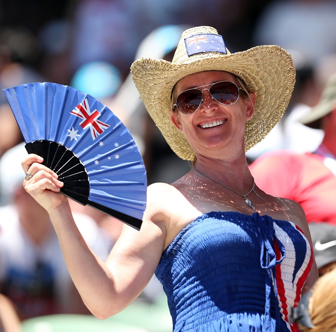 Tennis fans watch the action on Rod Laver Arena during day two of the Australian Open