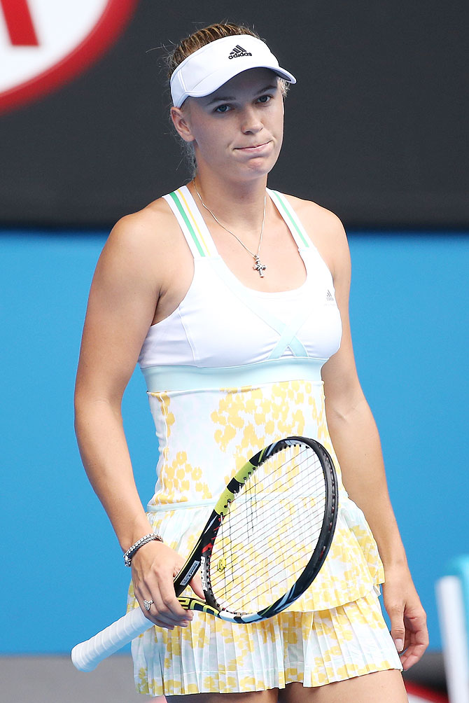 Caroline Wozniacki of Denmark reacts to a point in her third round match against Garbine Muguruza of Spain on Saturday