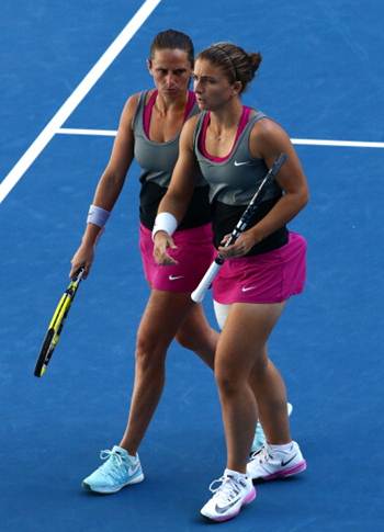 Sara Errani and Roberta Vinci of Italy in action during their fourth round doubles match against India's Sania Mirza and Cara Black of Zimbabwe