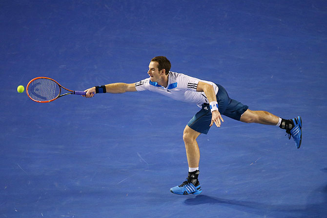 Andy Murray plays a forehand in his quarter-final match against Roger Federer 