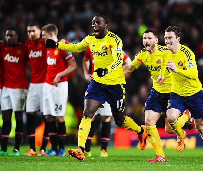 Jozy Altidore, Phil Bardsley and Adam   Johnson of Sunderland celebrate following their team's 2-1 victory in the penalty shootout