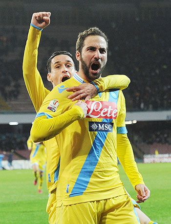 Gonzalo Higuain of Napoli celebrates after scoring the opening goal against Lazio during their Italian Cup quarters at Stadio San Paolo in Naples on Wednesday
