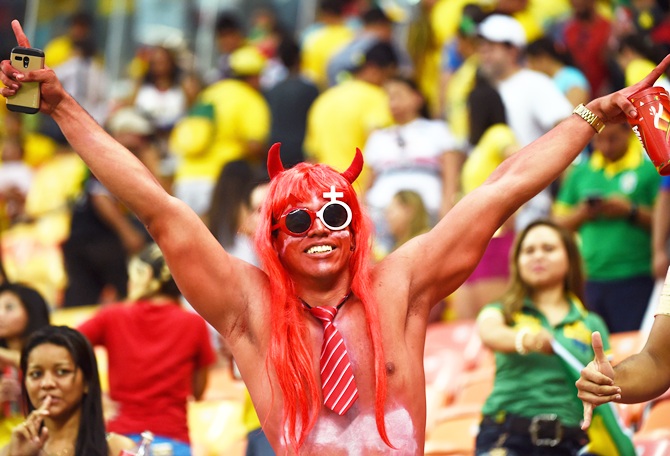 A fan poses during the match between Honduras and Switzerland