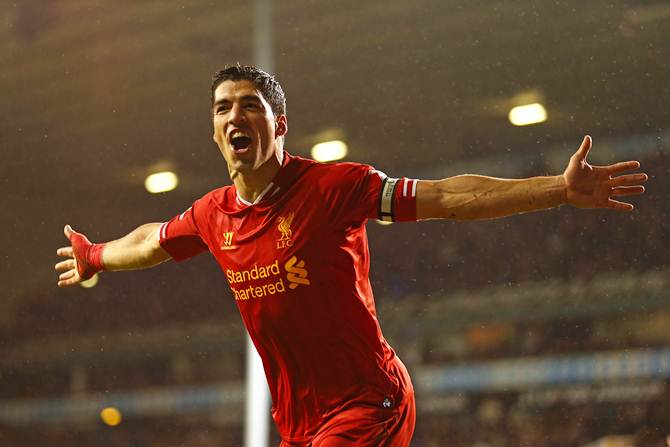 Luis Suarez celebrates scoring for Liverpool in the English Premier LEague