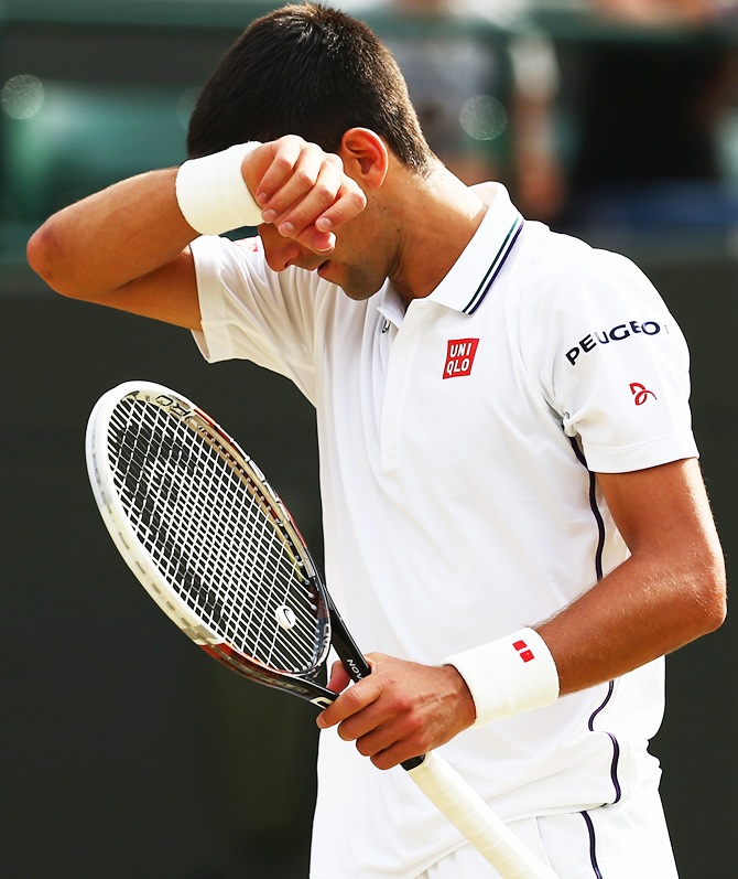 Novak Djokovic of Serbia reacts during his Gentlemen's Singles quarter-final match against Marin Cilic of Croatia