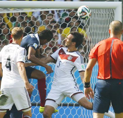 Germany's Mats Hummels (secong from right) heads the ball to score the team's goal against France