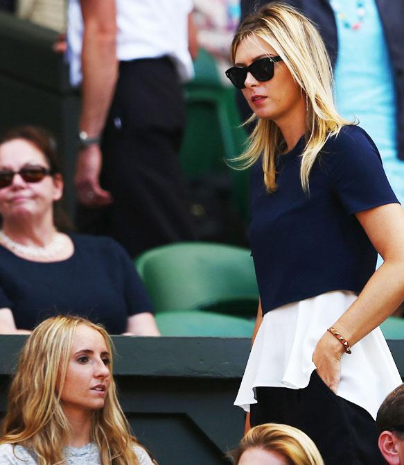 Maria Sharapova of Russia the girlfriend of Grigor Dimitrov of Bulgaria watches his   Gentlemen's Singles semi-final match against Novak Djokovic of Serbia