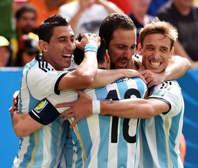 Argentina's players celebrate after Gonzalo Higuain scored the first goal against Belgium