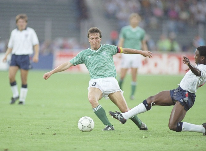 Paul Parker (right) of England tackles Lothar Mattheus (left) of West Germany   during the World Cup semi-final at the Delle Alpi Stadium in Turin, Italy
