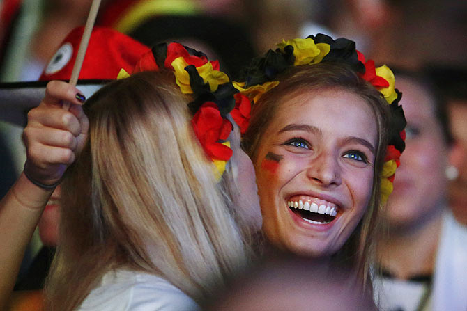 Germany fans celebrate after Thomas Mueller scores the opening goal against Brazil on Tuesday