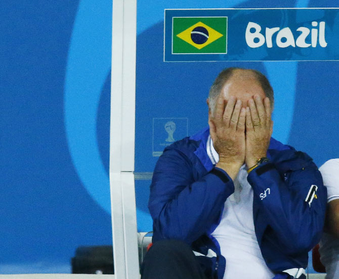 Brazil's coach Luiz Felipe Scolari reacts during his team's 2014 World Cup semi-finals against Germany at the Mineirao stadium in Belo Horizonte on Tuesday