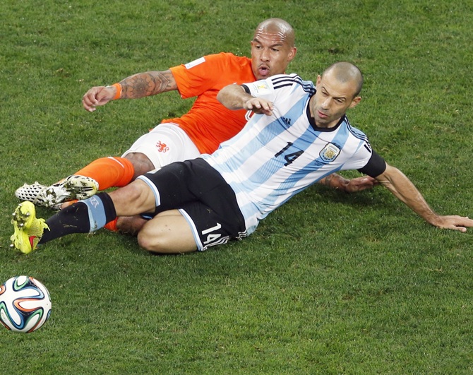 Nigel de Jong of the Netherlands, left, and Argentina's Javier Mascherano fight for the ball