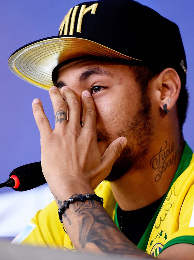 Neymar attends and speaks during a press conference