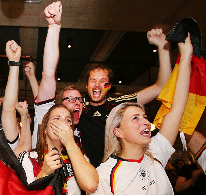German fans at Hophaus celebrate the win as the cup gets lifted while watching the 2014 FIFA World Cup final against Argentina in Melbourne, Australia, on Sunday