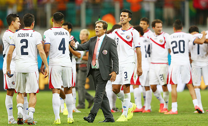 ead coach Jorge Luis Pinto of Costa Rica consoles his players after a defeat to   the Netherlands in a penalty shootout in the World Cup quarter-finals