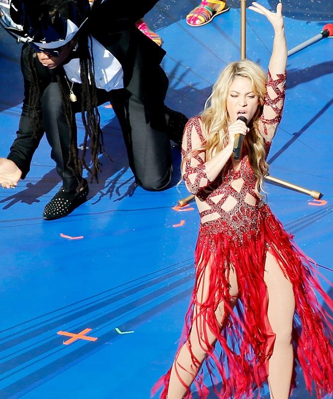 Musicians Carlinhos Brown and Shakira perform during the closing ceremony prior to the 2014 FIFA World Cup Brazil Final match between Germany and Argentina at Maracana