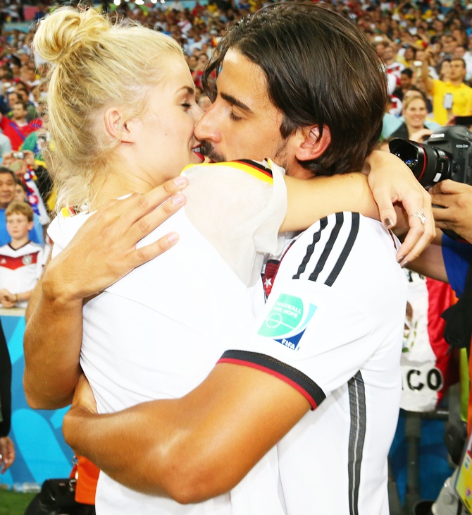 Sami Khedira of Germany celebrates with girlfriend Lena Gercke