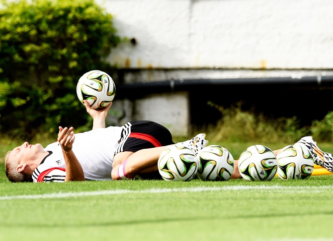 Bastian Schweinsteiger of Germany warms up during the Germany training session